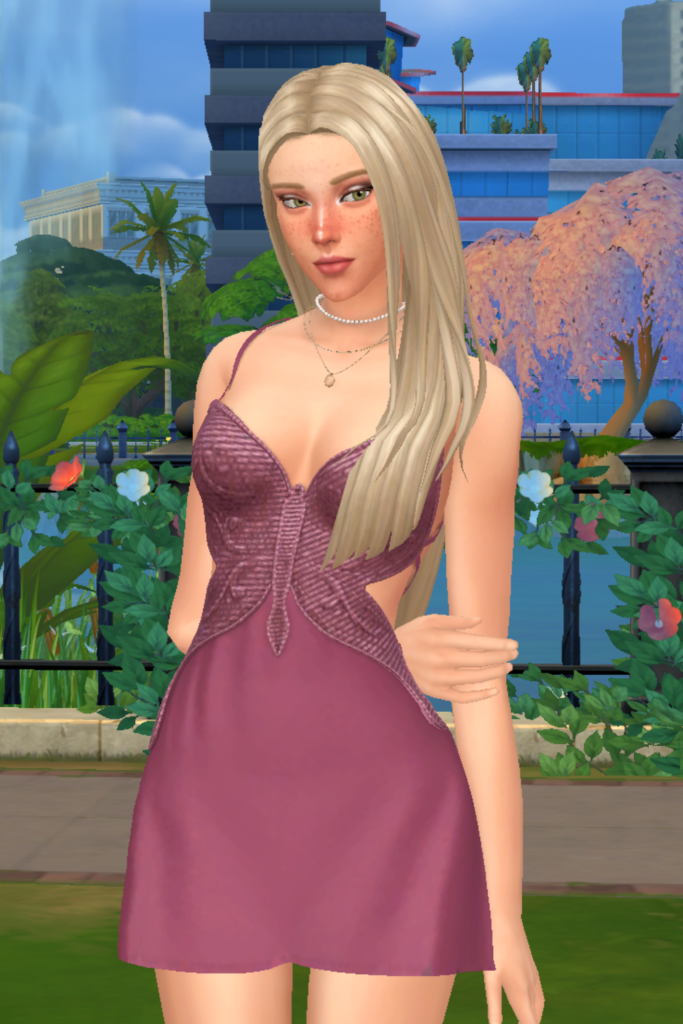 My Favourite Sims 4 CC Mini Dress Finds A blonde female Sim models a Sims 4 CC fit and flare mini dress. The dress is pink and the bodice is shaped like a butterfly and has beaded detailing.