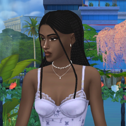 A female Sim wearing Sims 4 CC braided hair poses in a park. She has long, twist braid hairstyle tucked behind her ears with two face framing pieces.