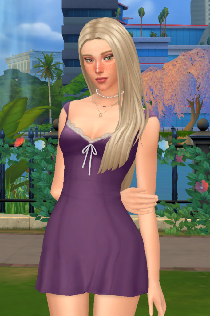 My Favourite Sims 4 CC Mini Dress Finds A blonde female Sim models a Sims 4 CC purple mini dress, with ruffles and a little bow on it