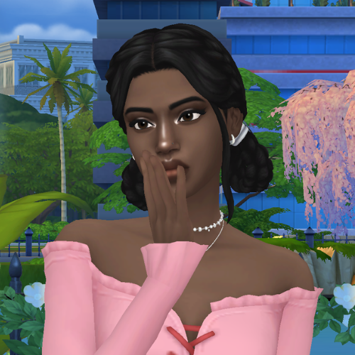A female Sim wearing Sims 4 CC braided hair poses in a park. She has two elegant braided buns.