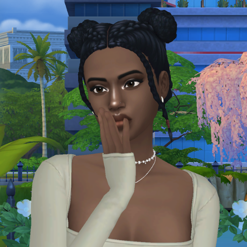 A female Sim wearing Sims 4 CC braided hair poses in a park. She has two curly spacebuns with two dutch braids leading to them, and braided face framing pieces in the front.
