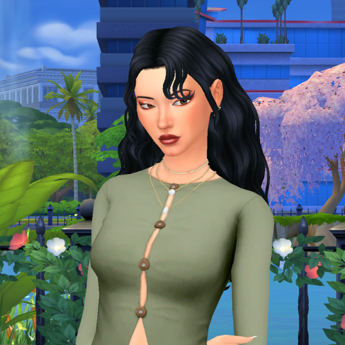 A female Sim wearing Sims 4 CC wavy long hair poses in a park. She has a wavy and voluminous hairstyle tucked behind her ears, with some face framing pieces in her face.