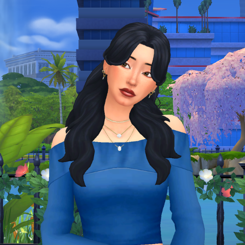 A female Sim wearing Sims 4 CC wavy long hair poses in a park. She has soft wavy hair with curtain bangs framing her face.